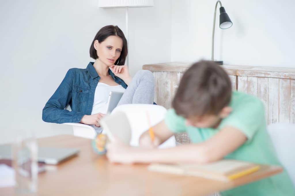 Young Teenage Boy Studying at Desk - Redeemed Life Counseling