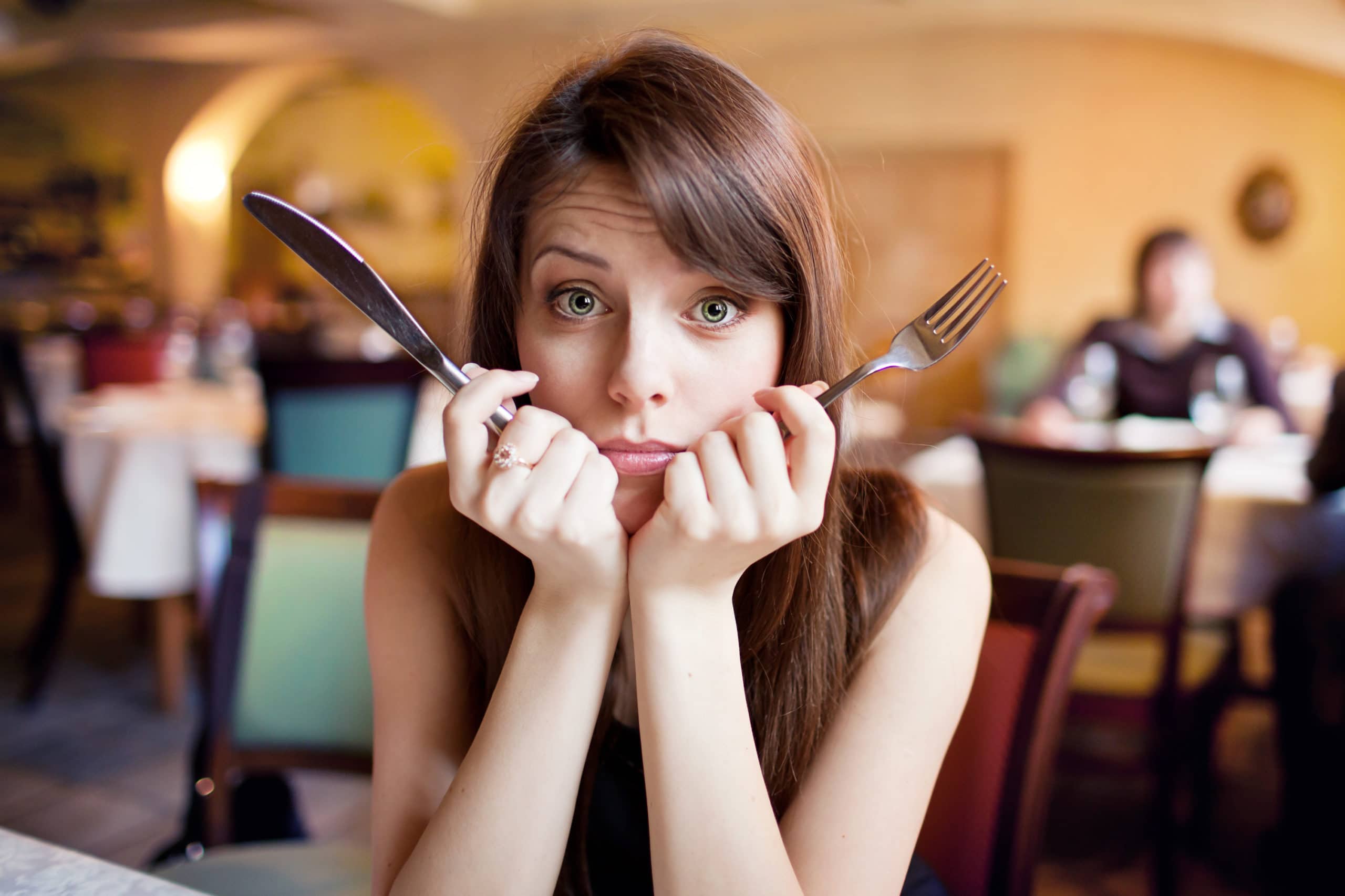 Hungry Girl in a Restaurant - Redeemed Life Counseling